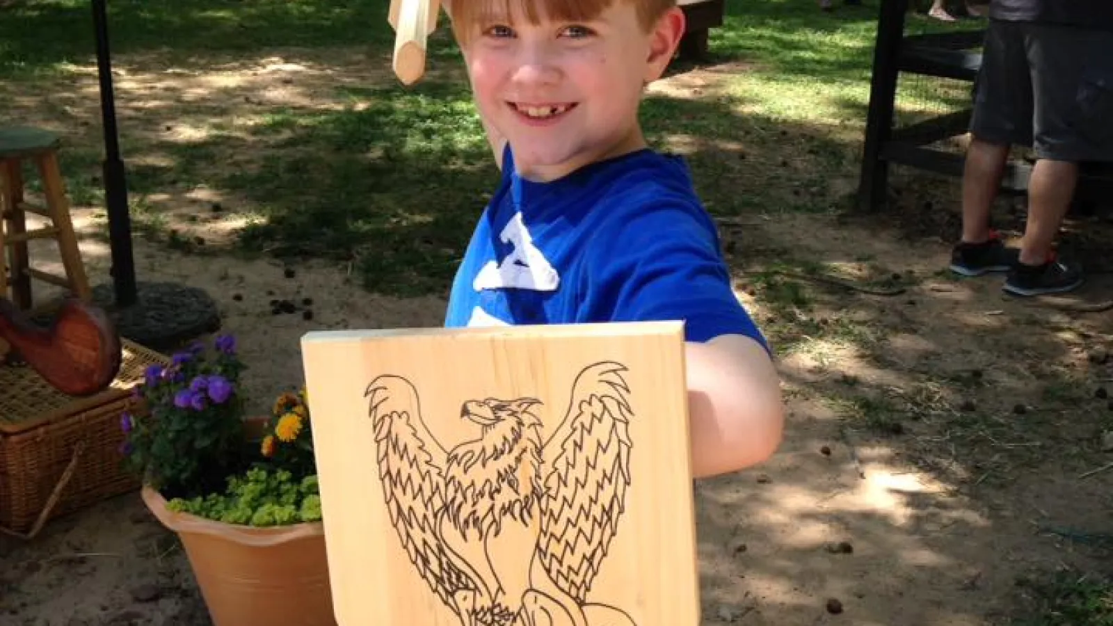 a boy holding a shield
