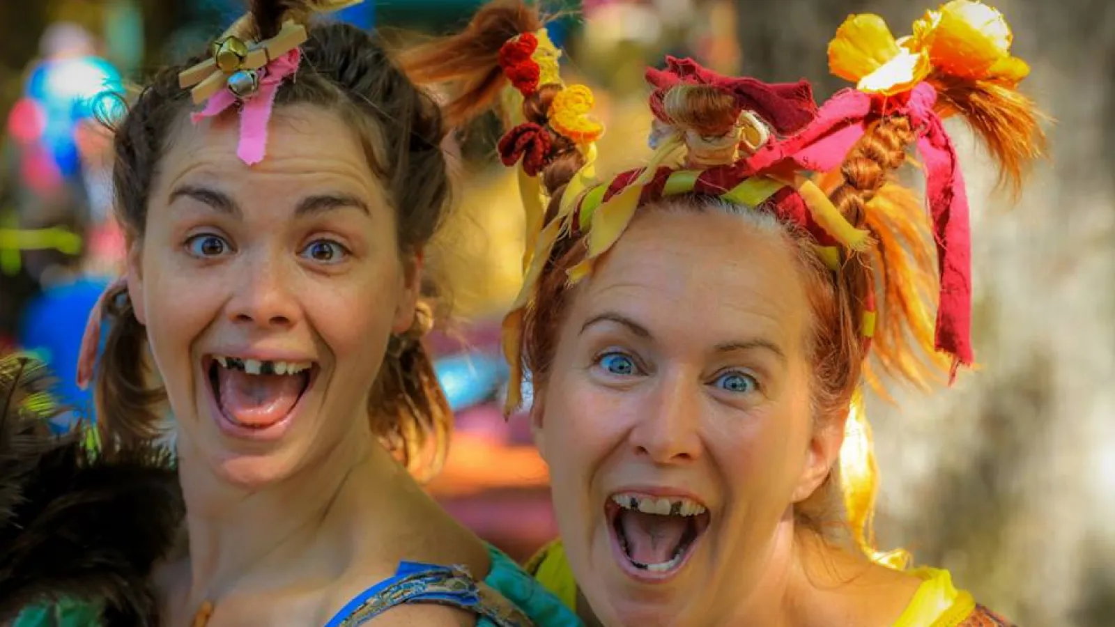 two girls wearing flower crowns