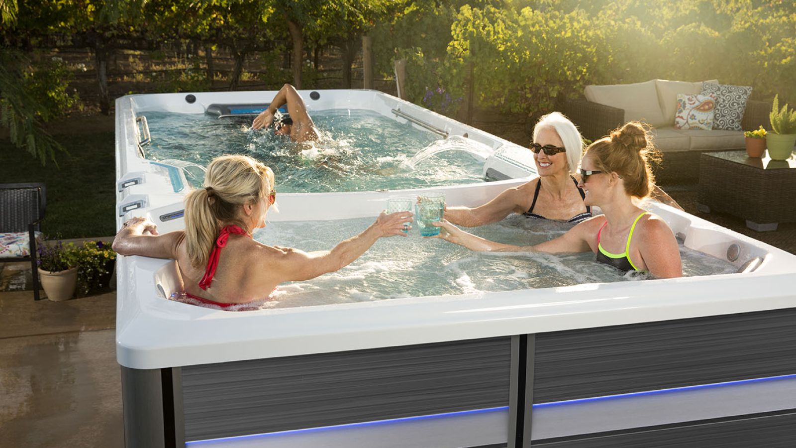 a group of people sitting in a swim spa