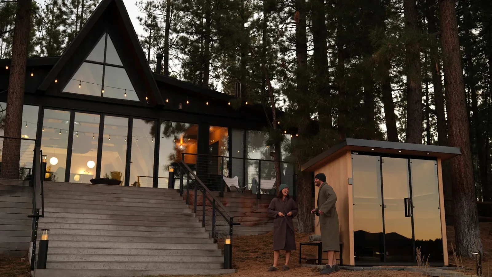 an outdoor sauna in front of a house
