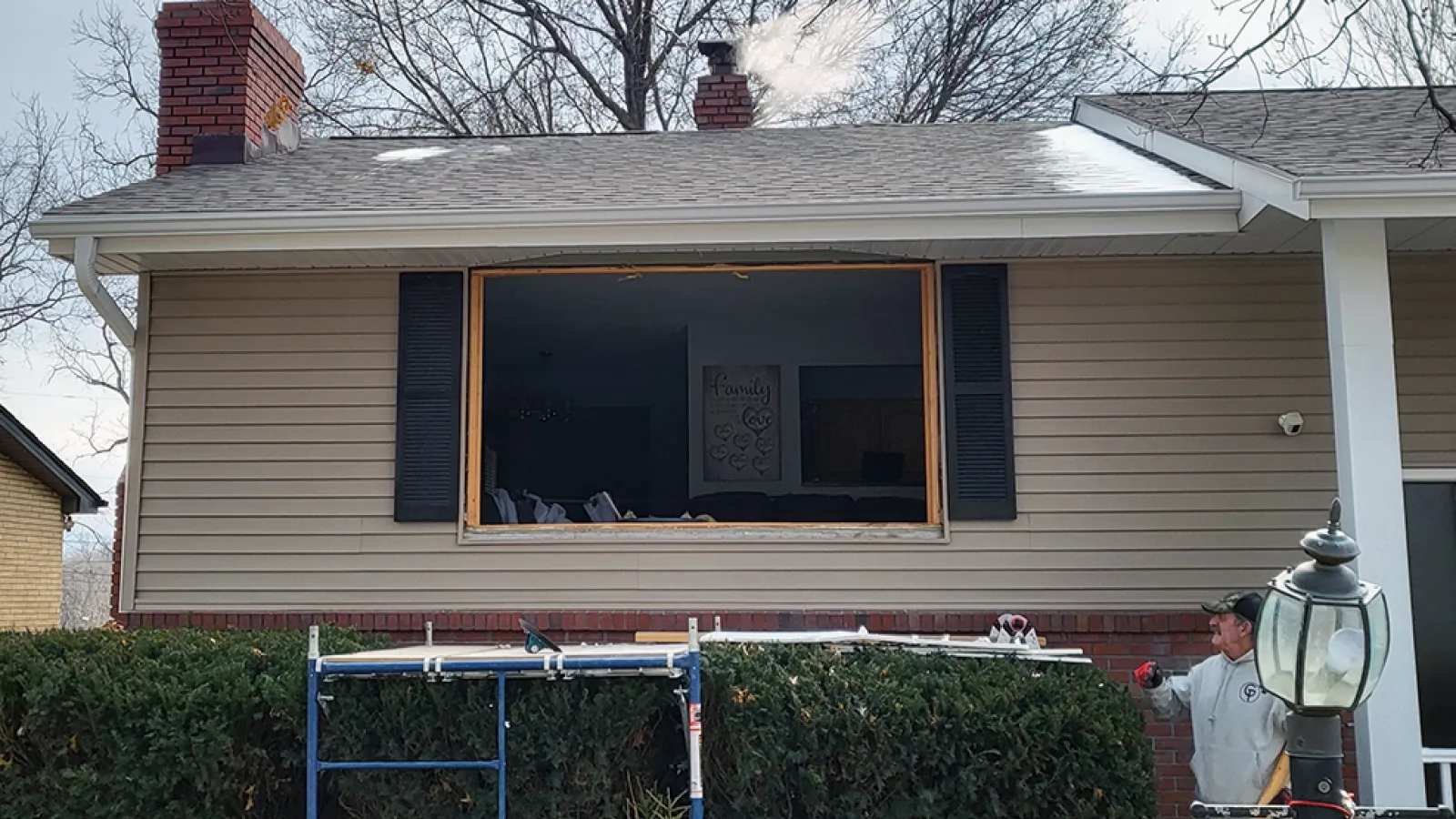 a person standing outside a house