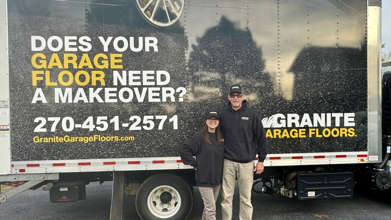 The Taylors standing in front of their Granite Garage Floors truck advertising garage floor makeovers.