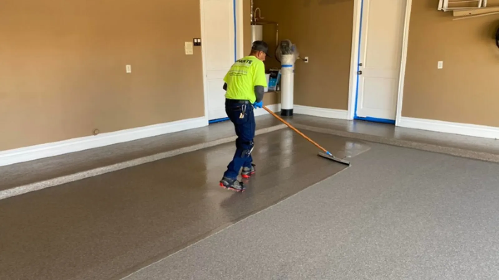 a man holding a broom