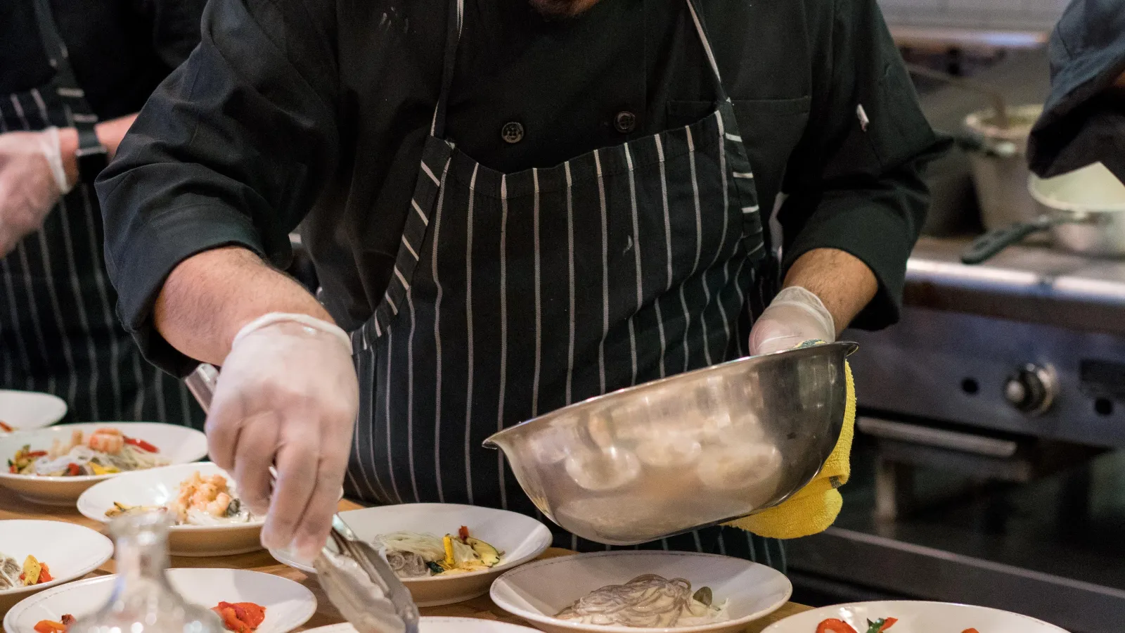 a man preparing food in a restaurant