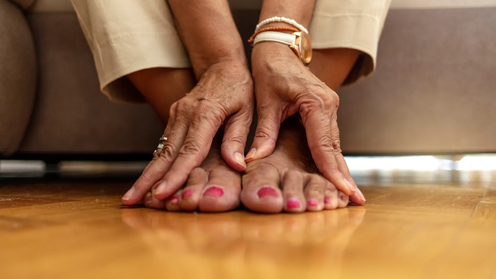 a pair of hands on their feet