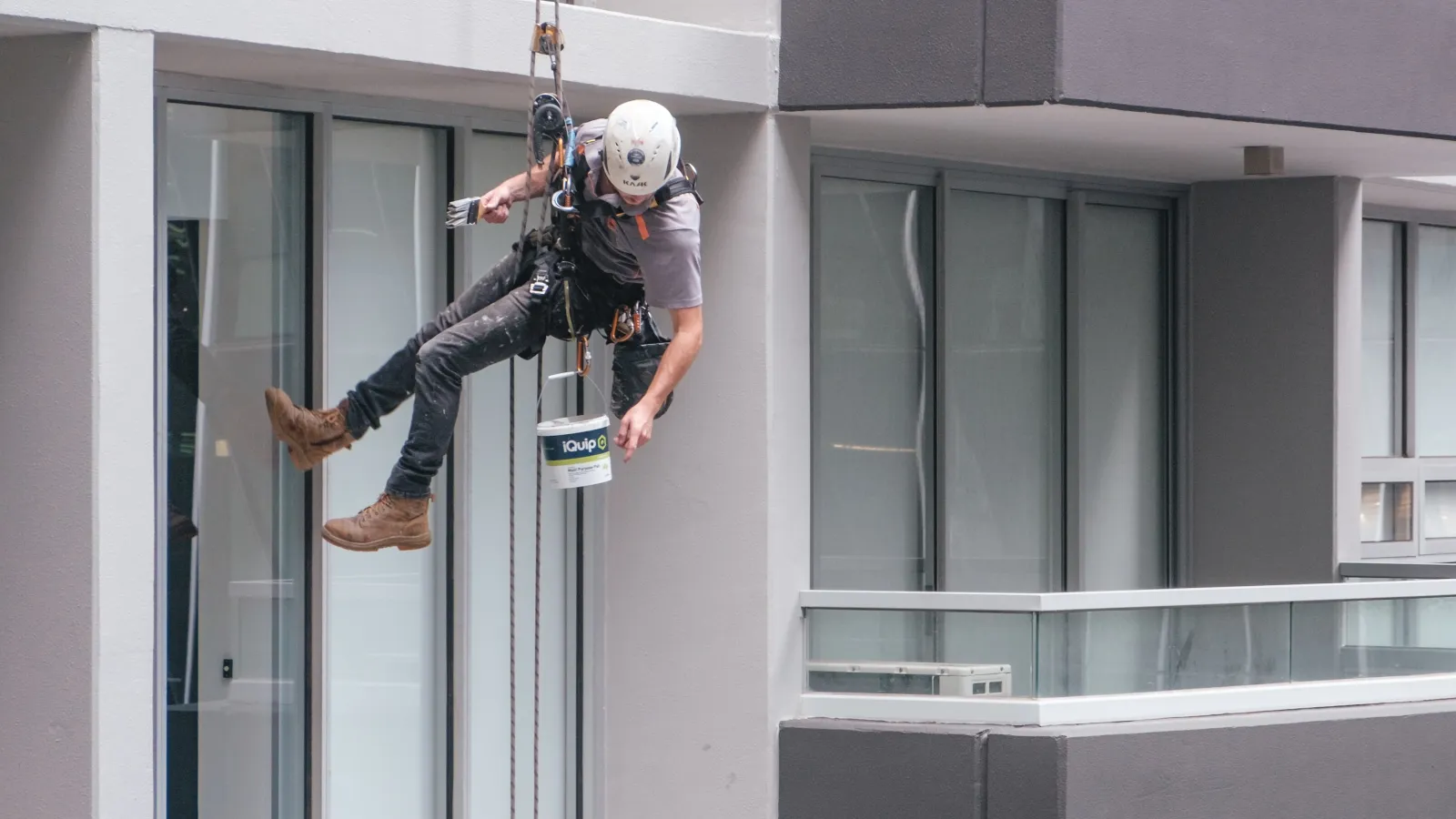 a person scaling a building