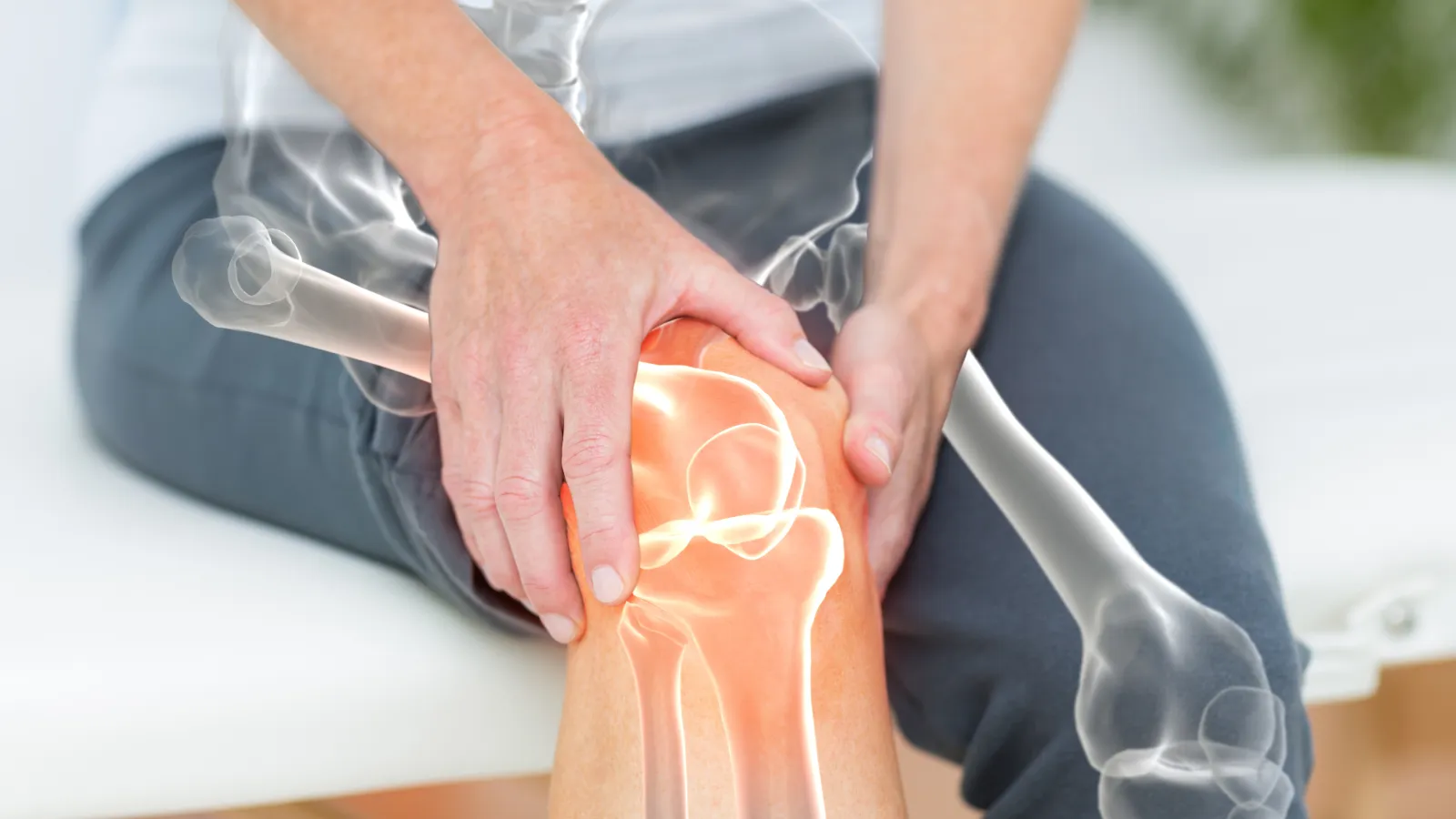 a person holding their knee