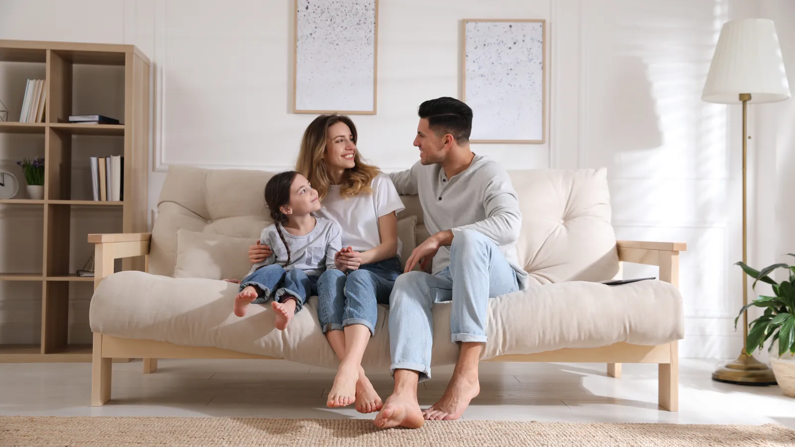 a family sitting on a couch