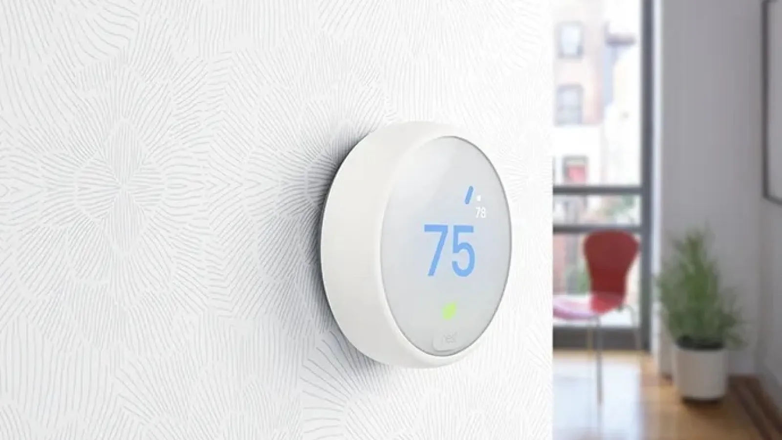 a white nest thermostat installed on wall