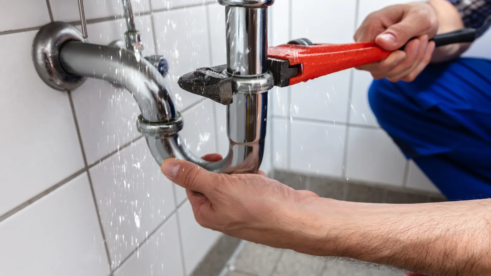 a man using a faucet