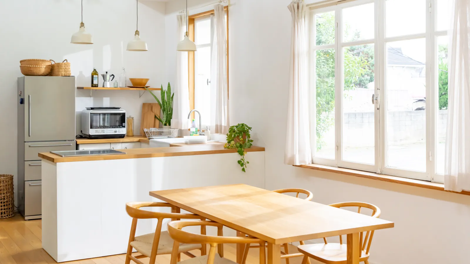 a kitchen with a table and chairs