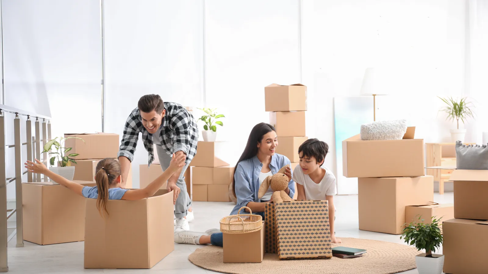 a group of people in a room with boxes and a person holding a box