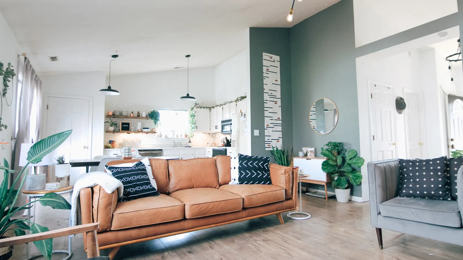 a living room with a couch and chairs