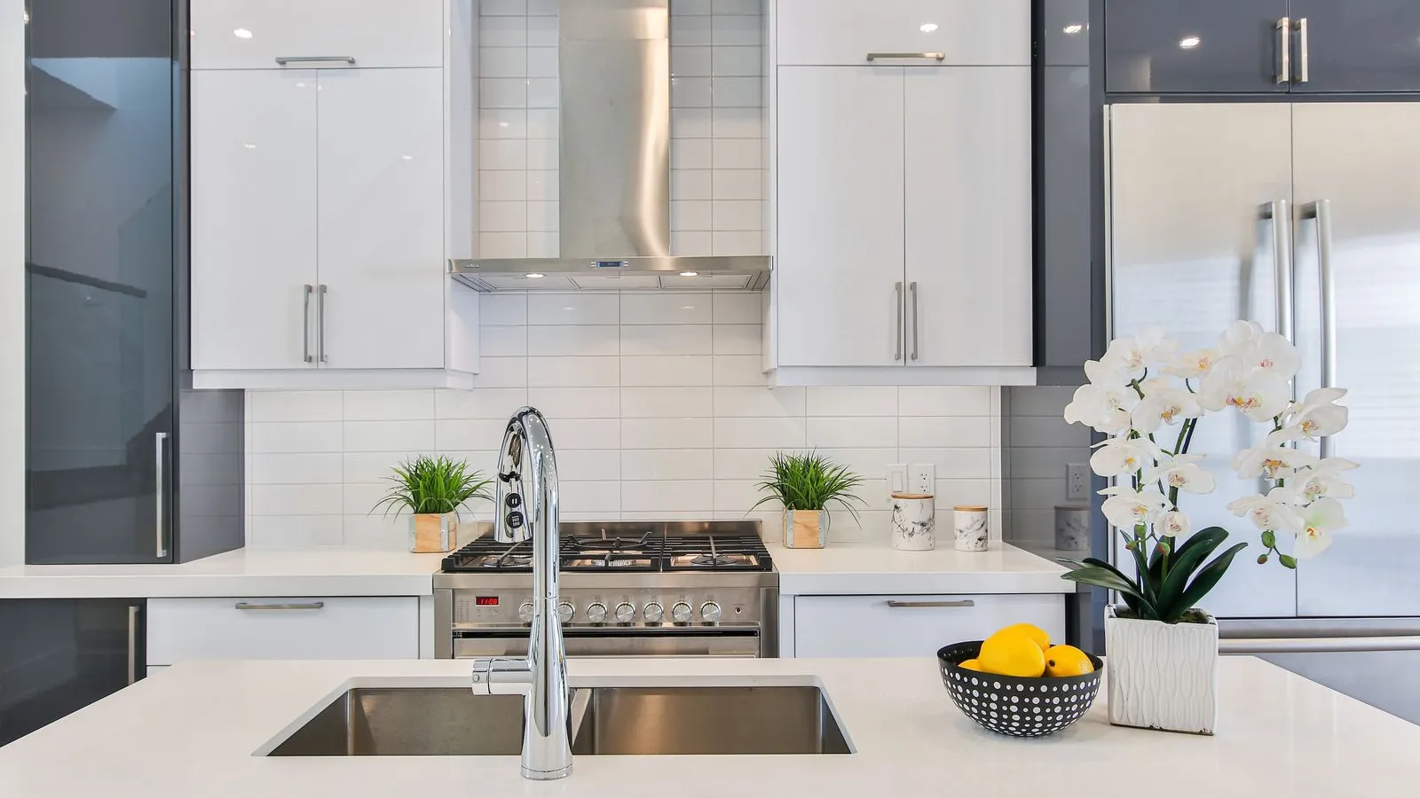 a kitchen with white cabinets