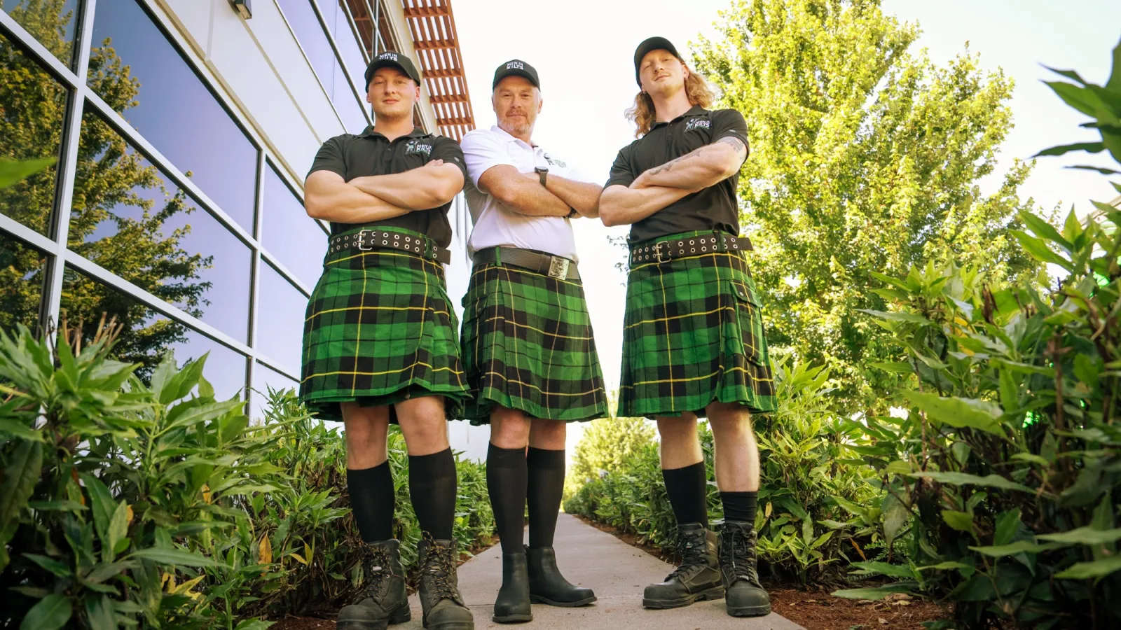 a group of people in kilts