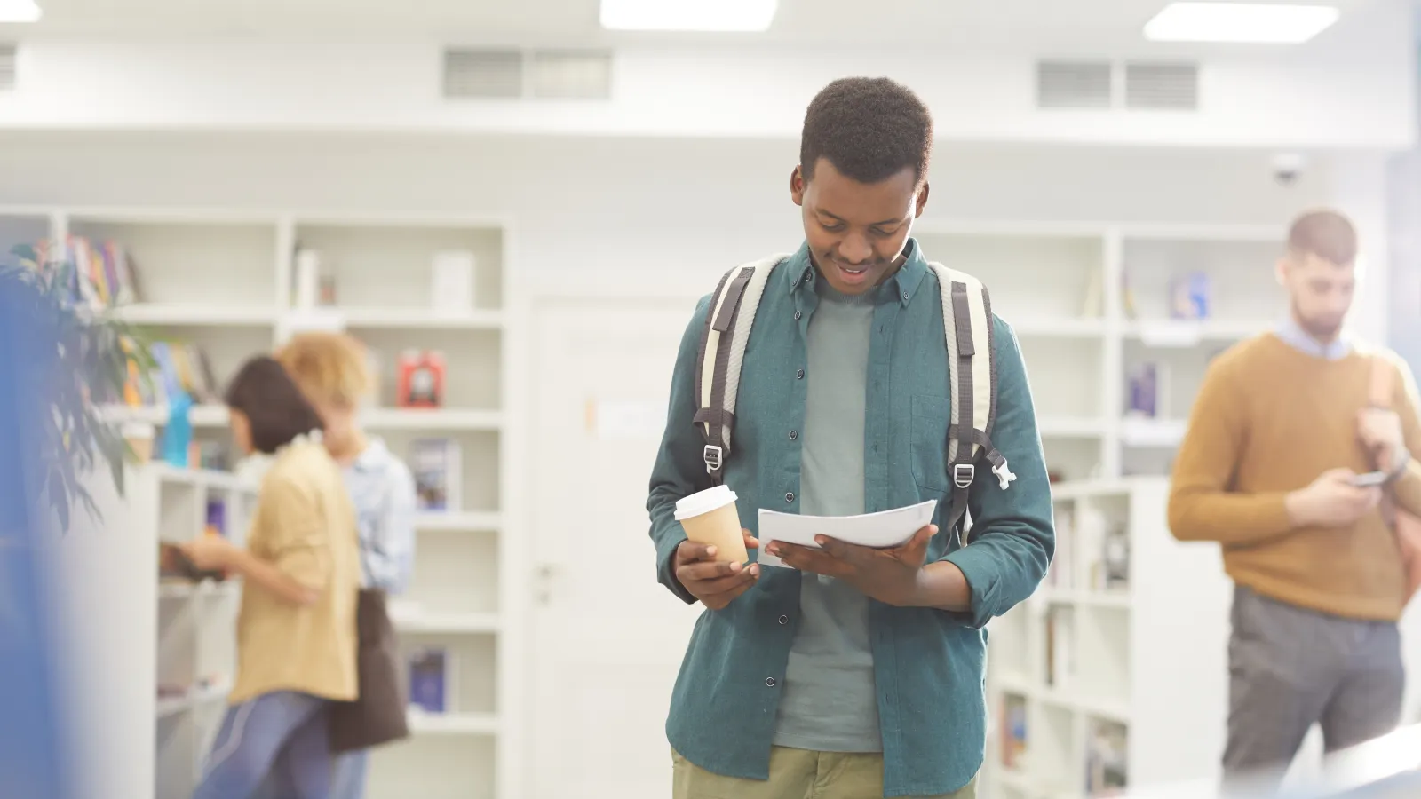 college student walking in the library