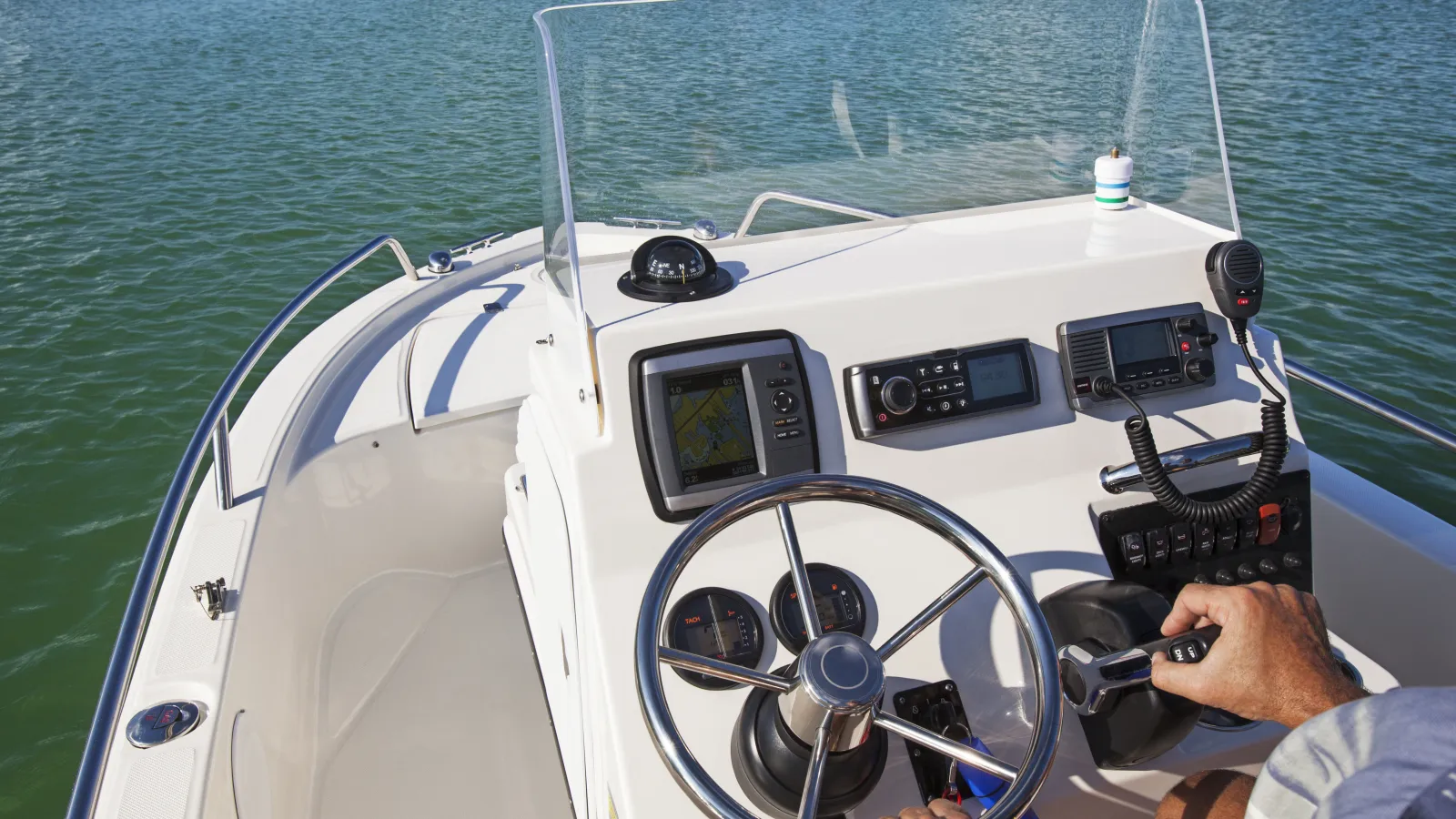 a man driving speed boat