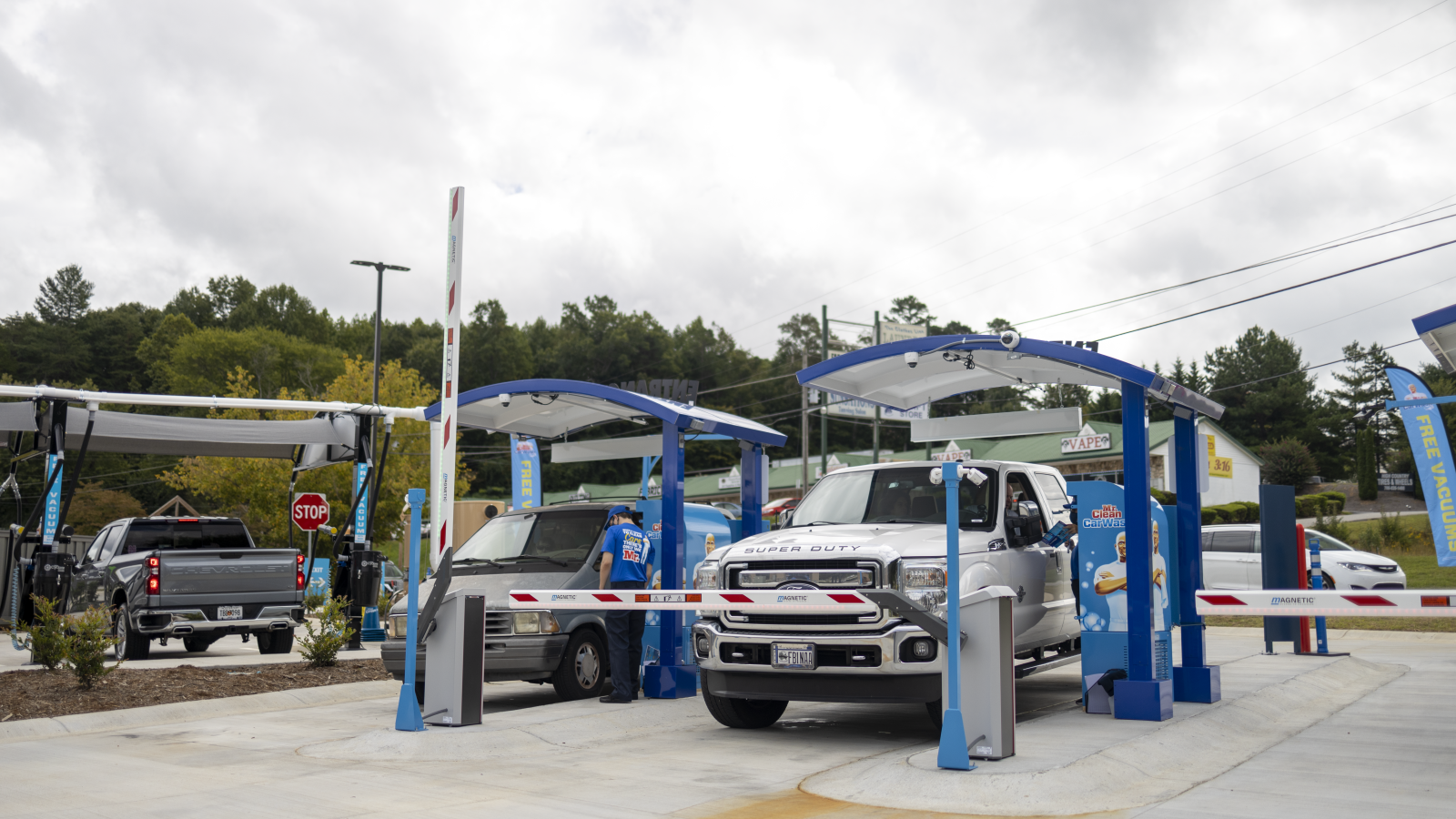 a gas station with cars