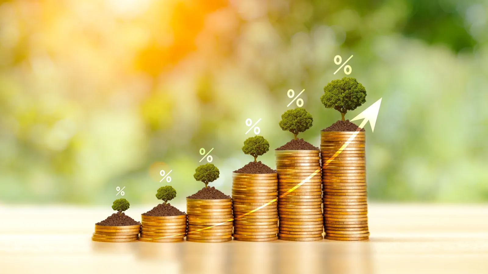Stacks of gold coins with soil and growing trees symbolizing increasing investment returns and financial growth.