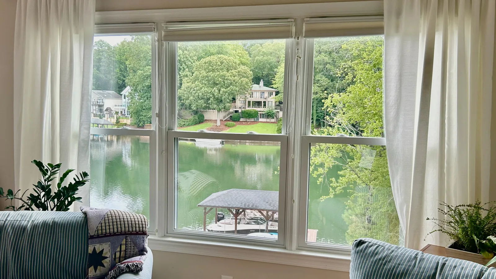 3 double hung sash windows with view overlooking the lake