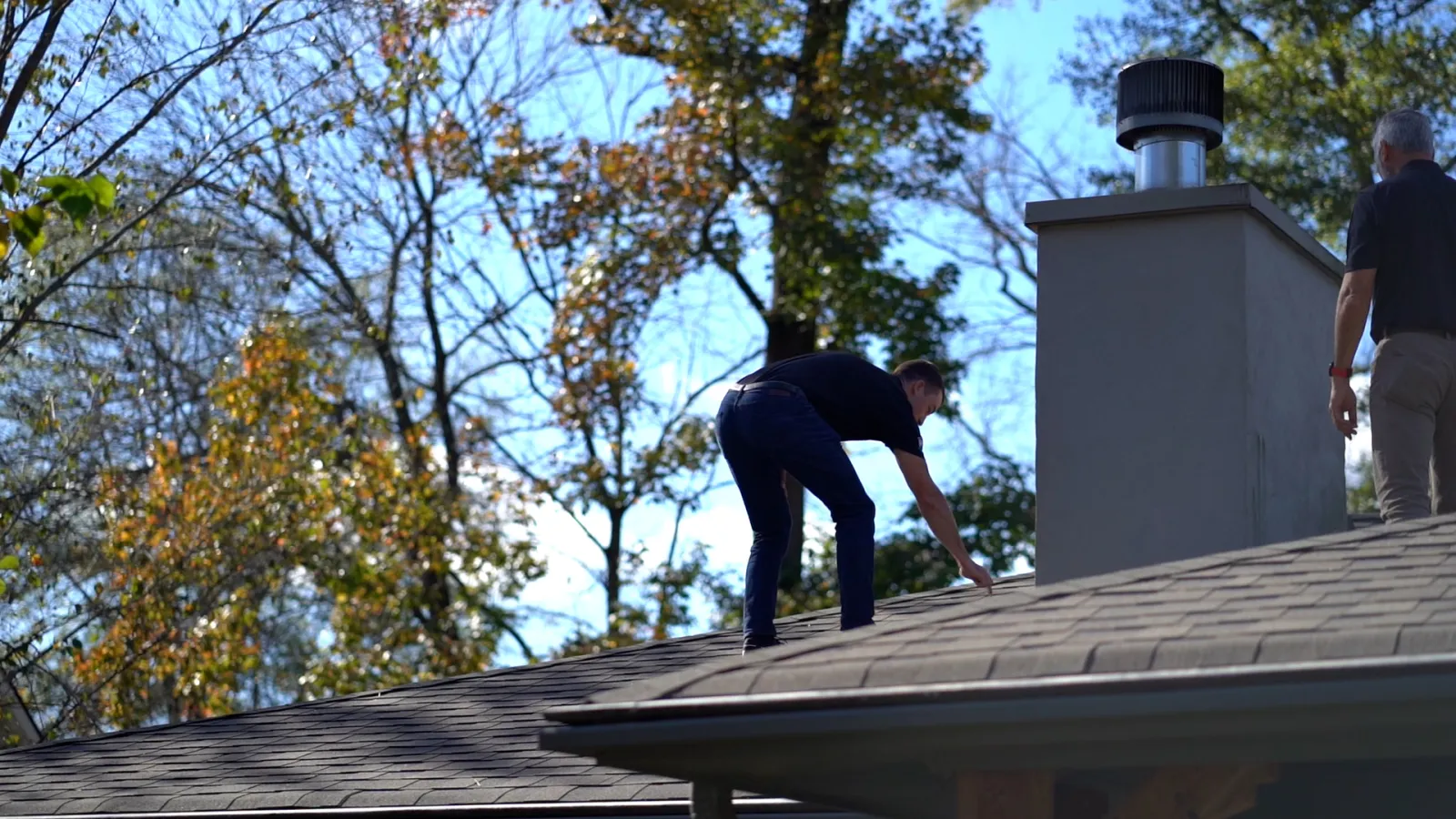 a man standing on a roof