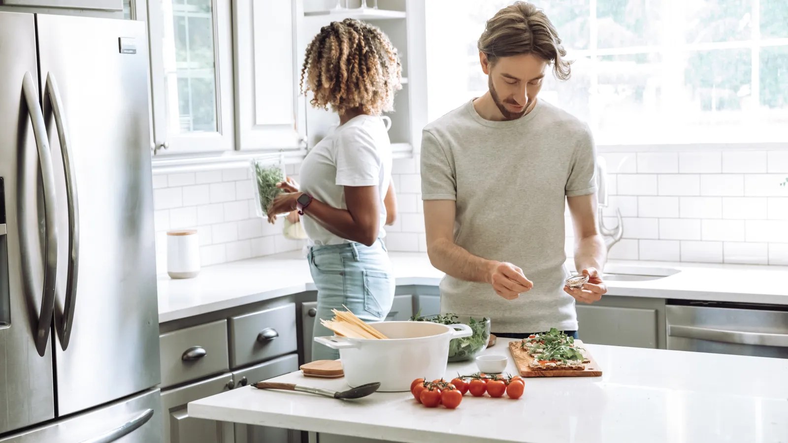 a person and a child preparing food