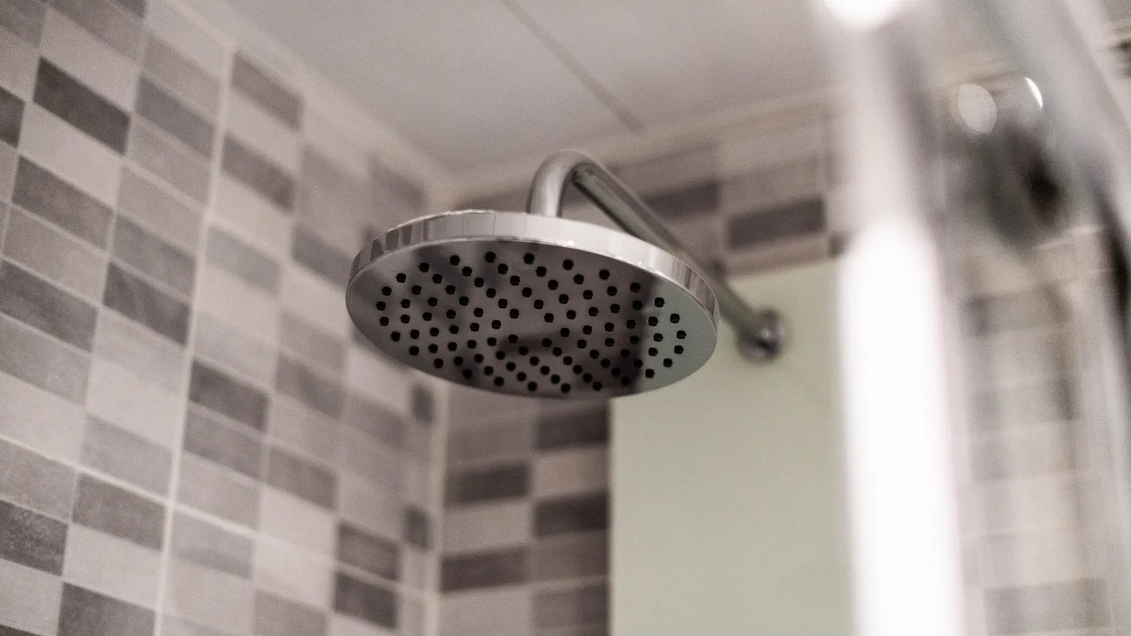 a shower head in a bathroom