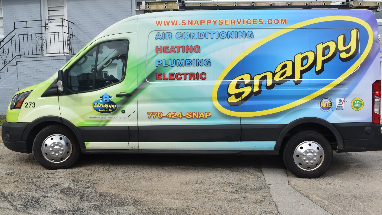 a van parked in front of a building