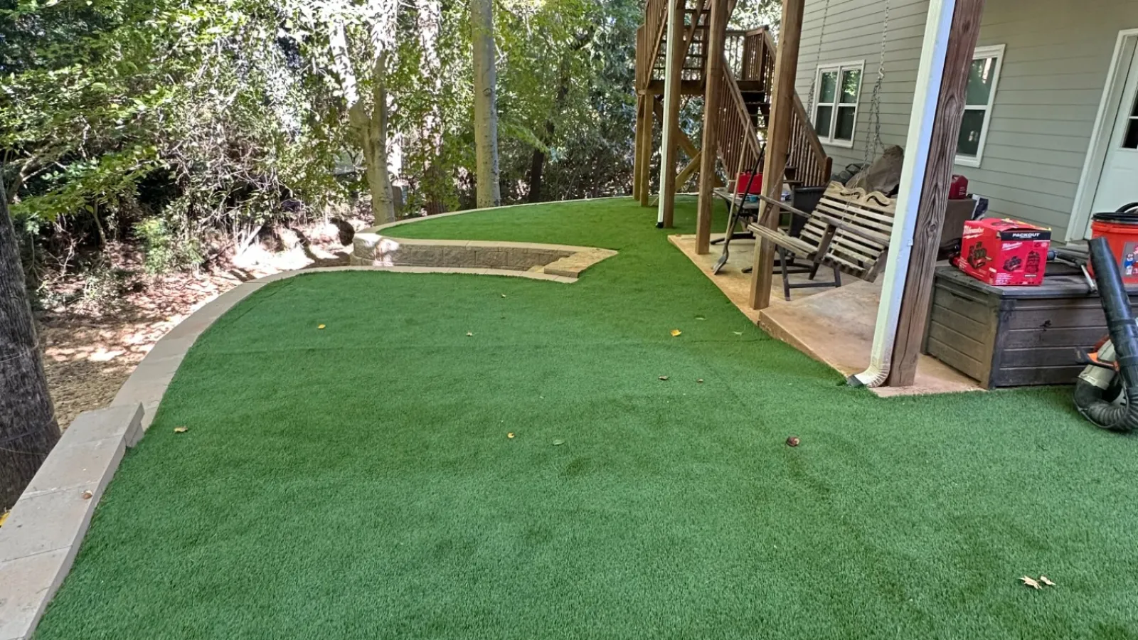 a lawn with a building in the background