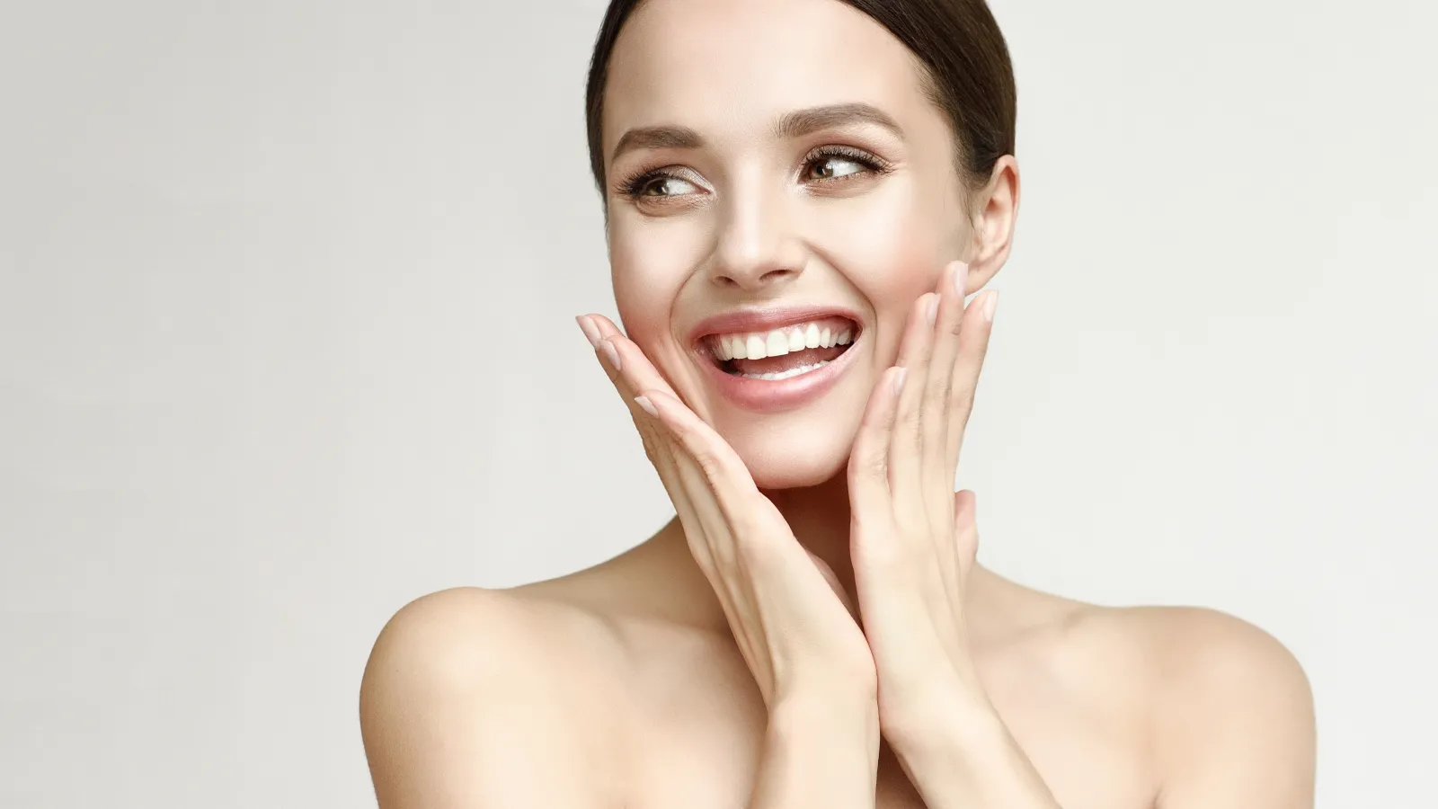 a person with the hands on the face