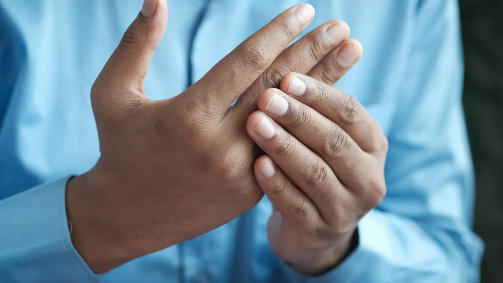 a person holding their hand