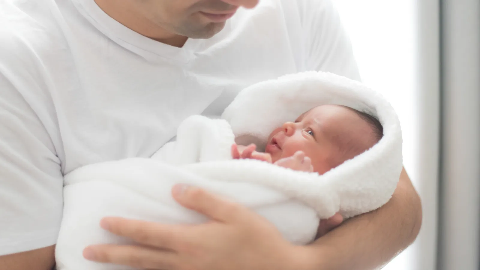 a person holding a baby