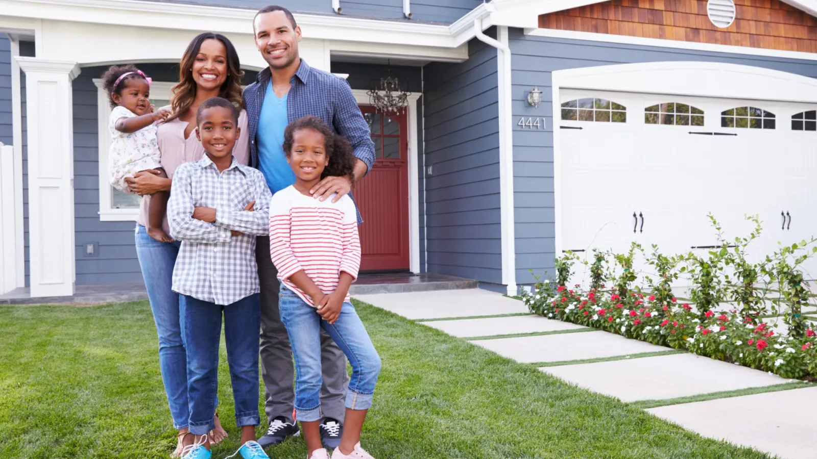 Family in weed free lawn