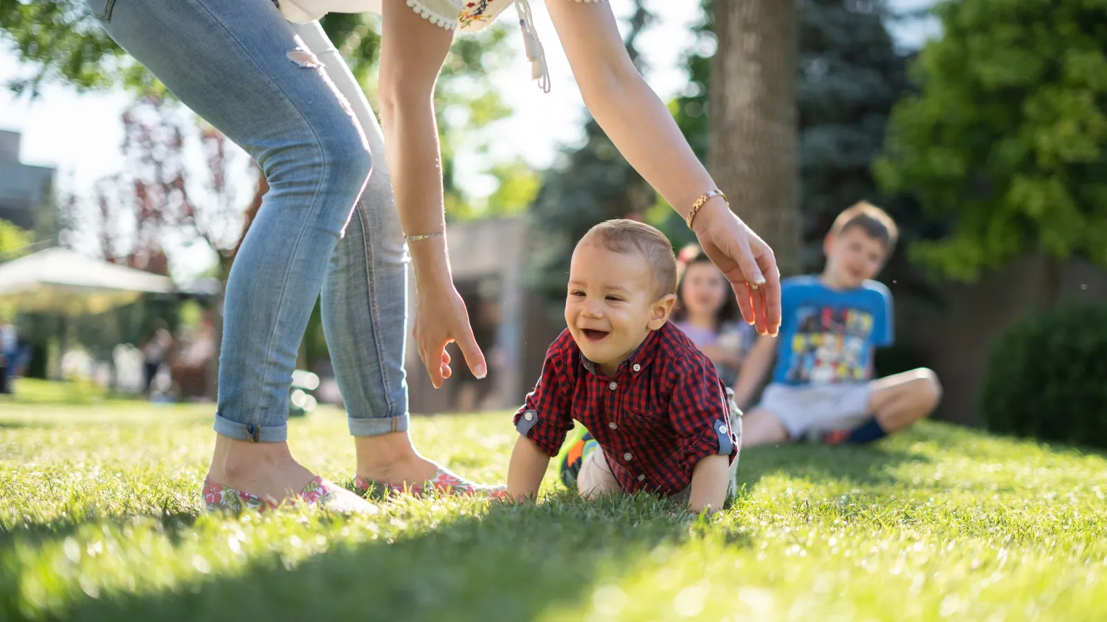 baby crawling in grass