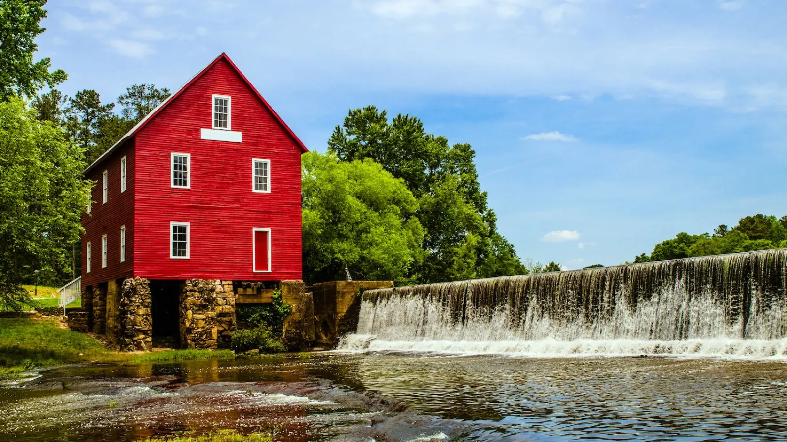 red building with waterfall