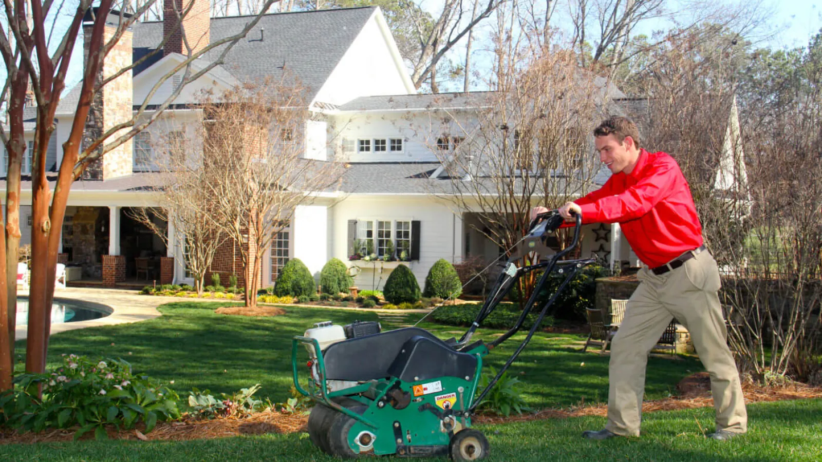 a man pushing a lawn mower