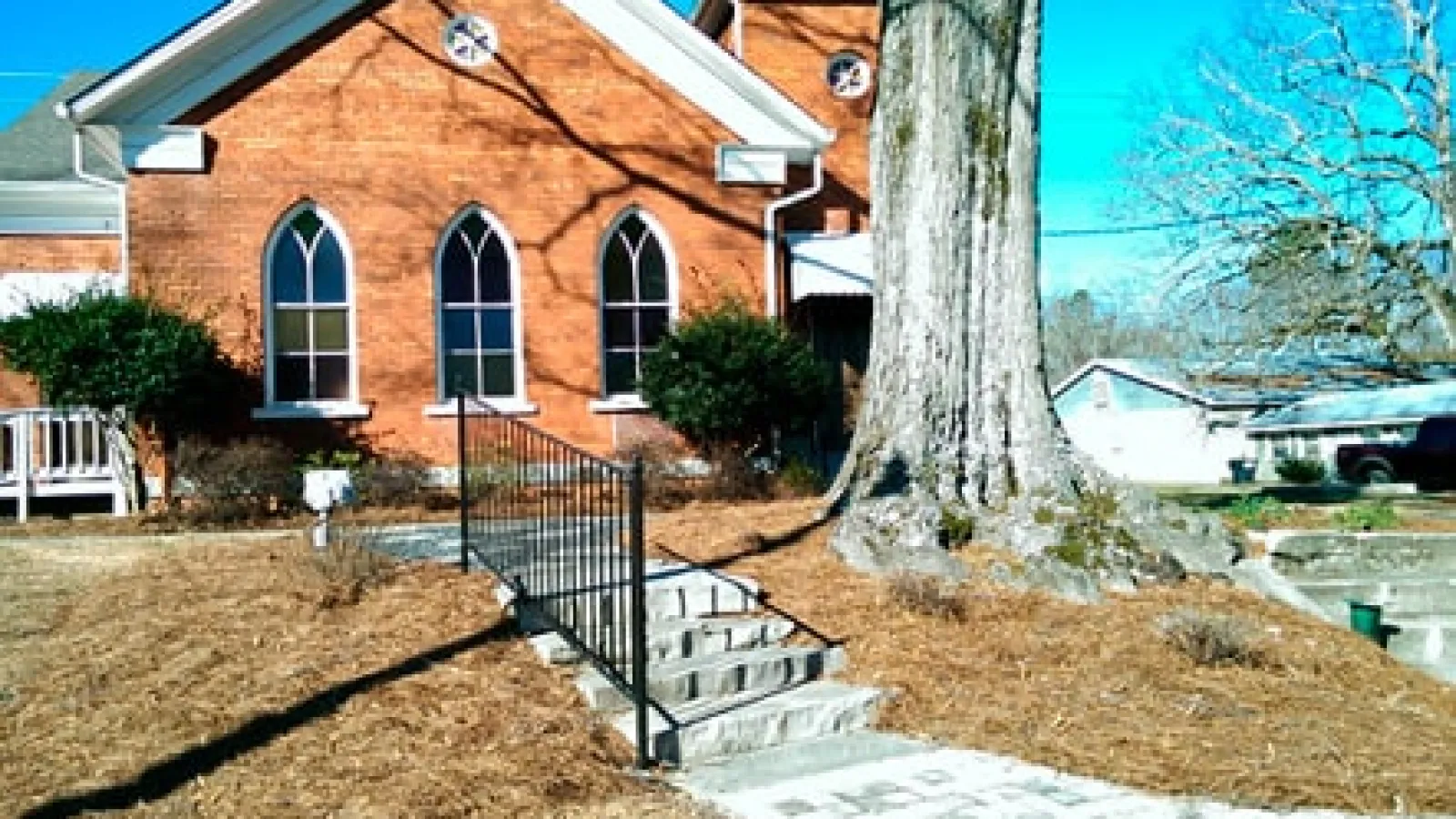 brick building with big tree