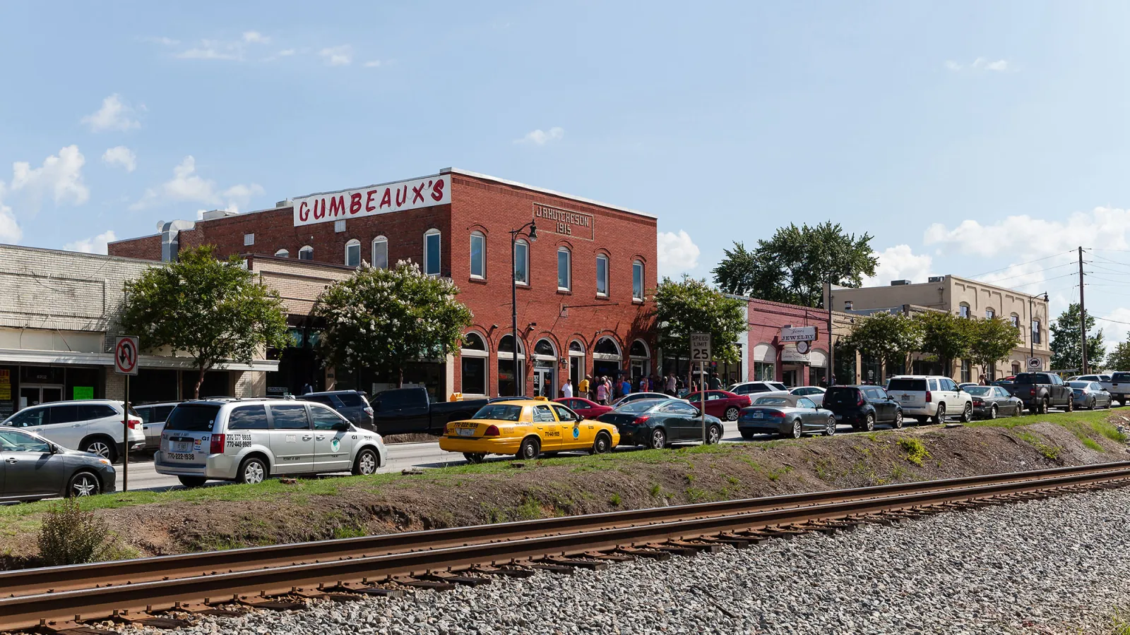 cars by railroad track