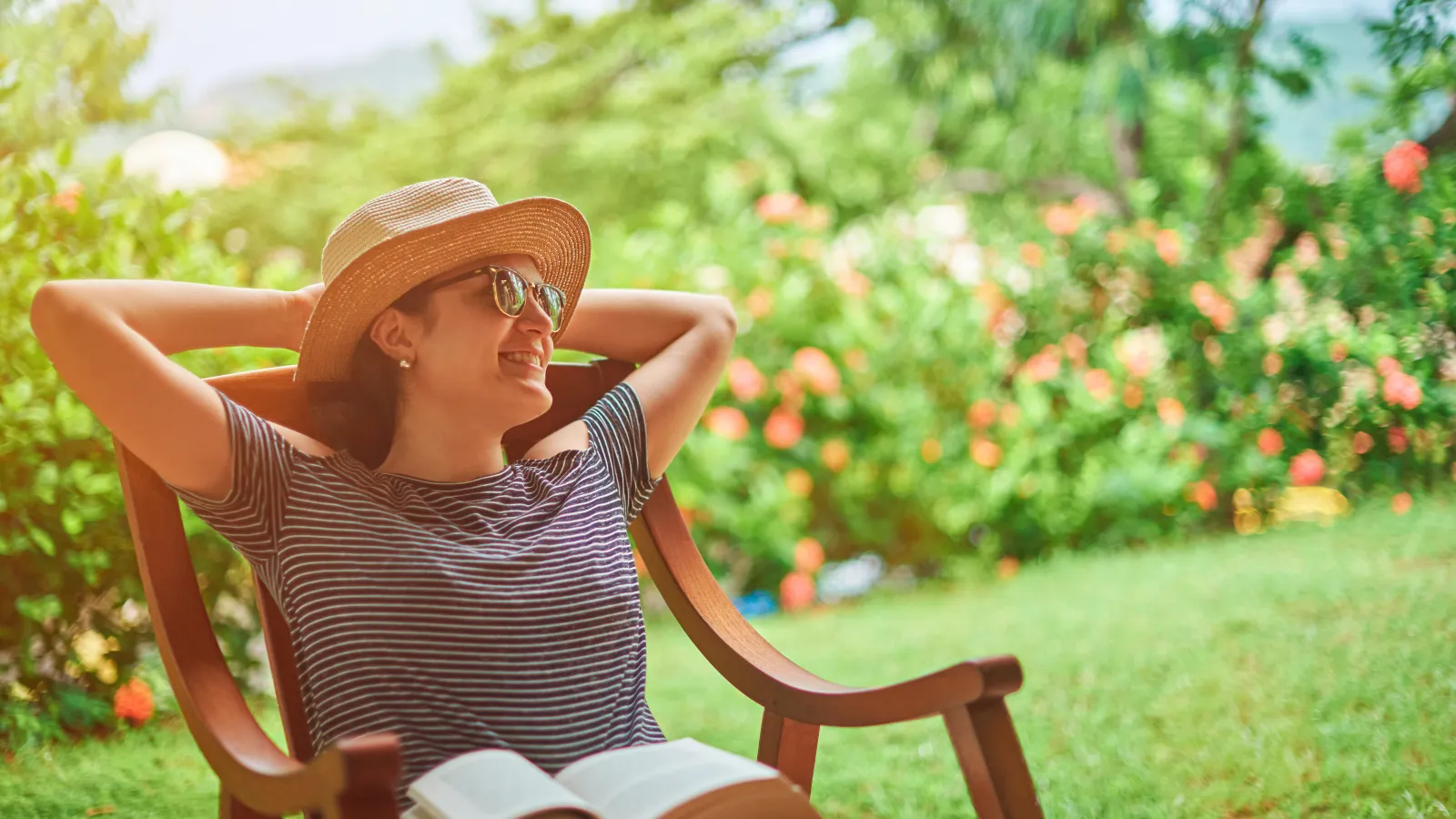 a woman sitting in a chair outside