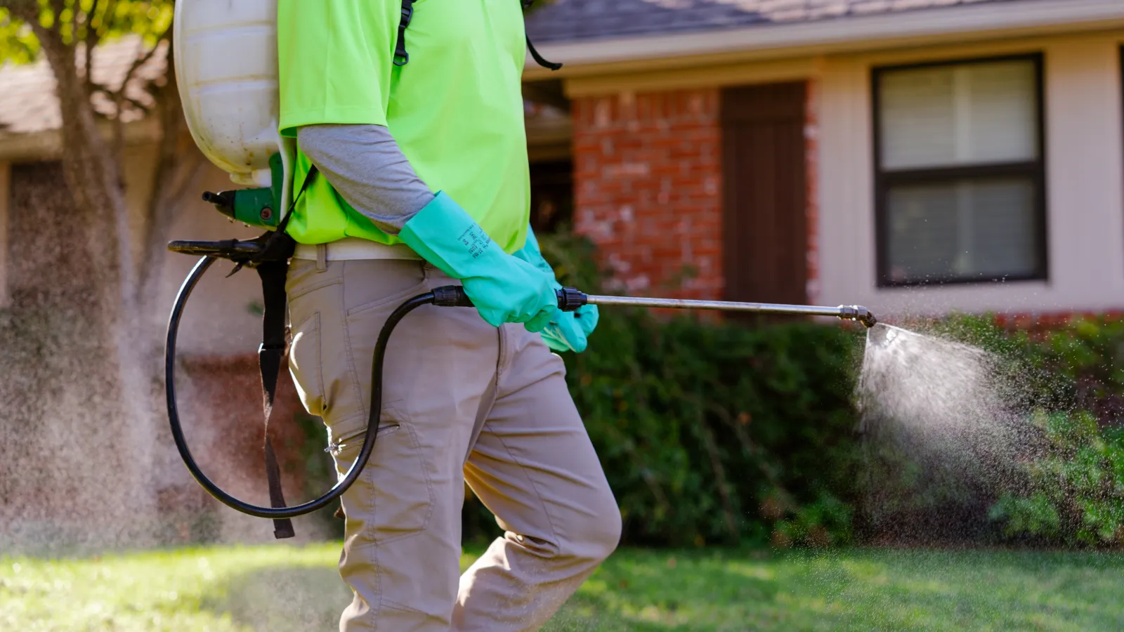 a person wearing a safety vest and gloves