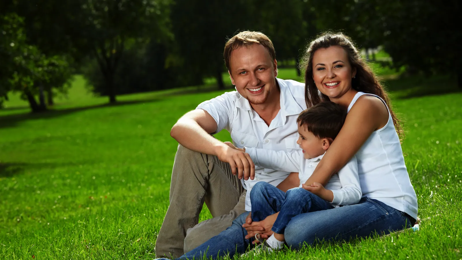 Family sitting in grass