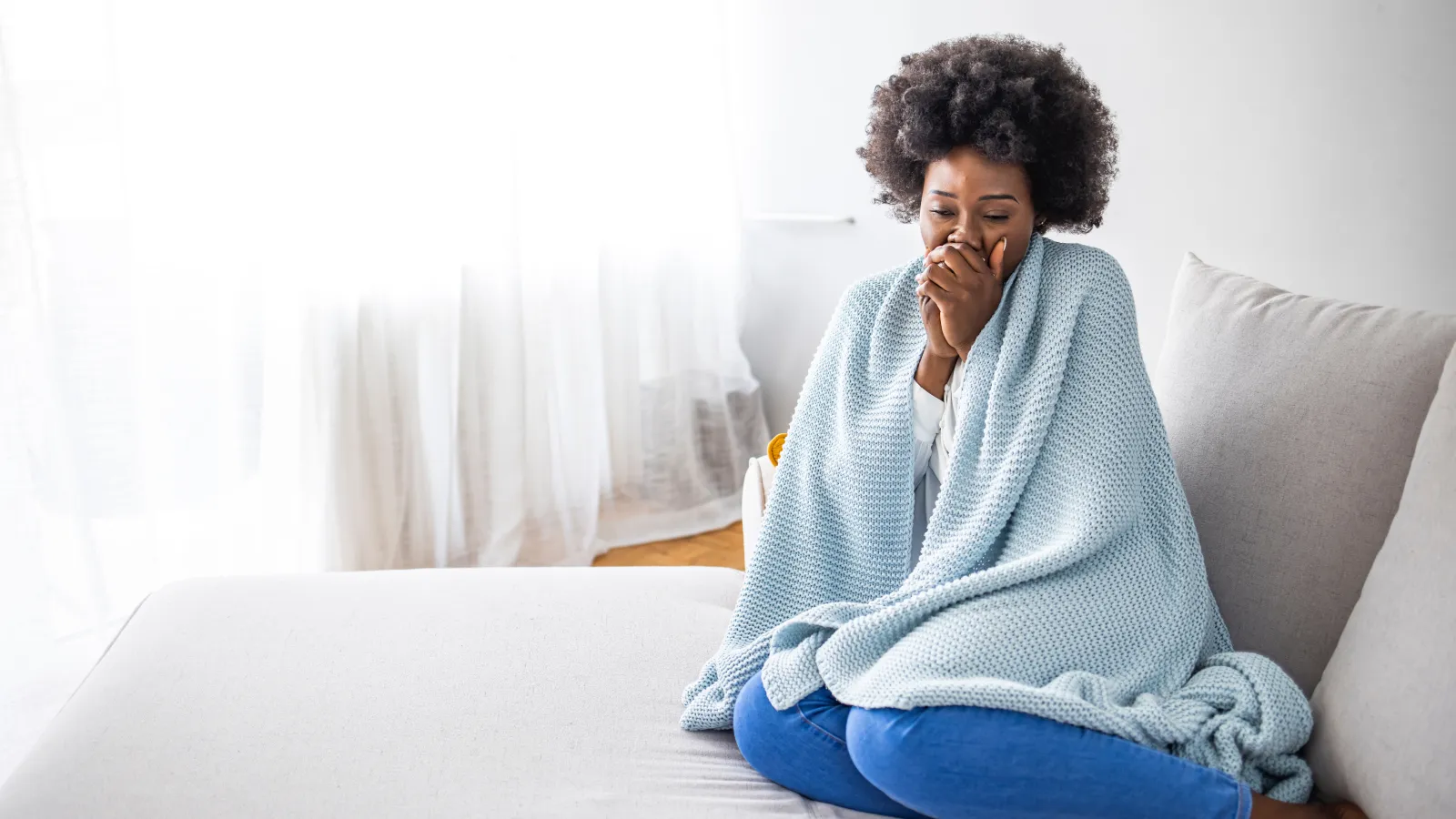 a woman sitting on a couch