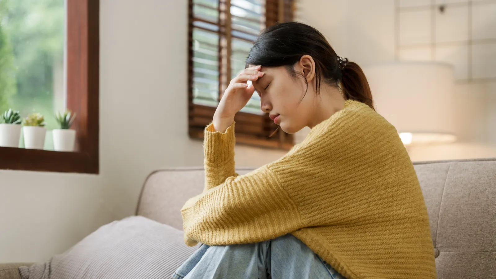 a woman sitting on a couch