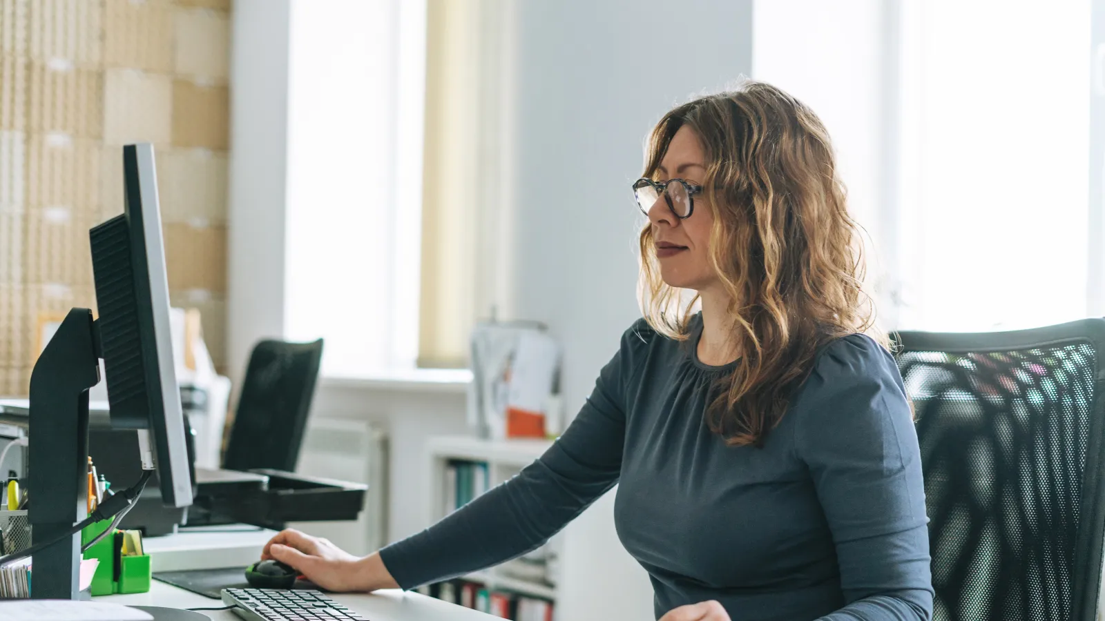 a woman sitting at a desk