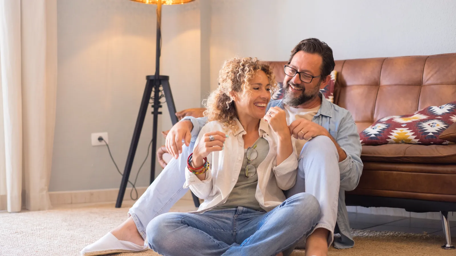 A couple sitting on the floor