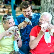 a group of people holding food