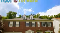 Two-story brick house with dormer windows under blue sky and Roof It Forward logo with children graphics.