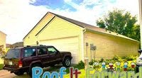 Yellow house with white garage doors, brown SUV parked in driveway, sunny sky, and Roof It Forward banner.