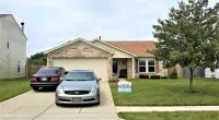 cars parked in front of a house