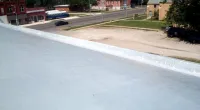 a person sitting on the side of a road